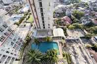 Bangunan Tidy and Best Deal Studio Apartment Vida View Makassar By Travelio