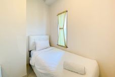 卧室 Modern and Cozy Look Studio Apartment Capitol Park Residence By Travelio