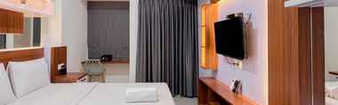 Bedroom 2 Studio Scenic Apartment at Vida View Makassar By Travelio