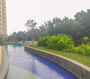 Swimming Pool 6 Restful and Cozy Studio at Transpark Cibubur Apartment By Travelio