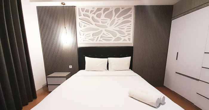 Kamar Tidur Modern Classic Studio at Apartment Mataram City By Travelio