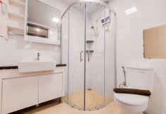 In-room Bathroom 7 Simple and Strategic 3BR Sky House BSD Apartment By Travelio