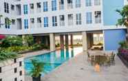 Swimming Pool 5 Homey and Cozy Stay Studio Room Grand Dhika City Apartment By Travelio