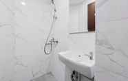 In-room Bathroom 4 Nice and Cozy Studio at Pacific Garden Alam Sutera Apartment By Travelio