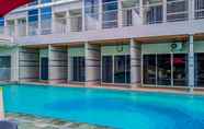 Swimming Pool 6 Nice and Cozy Studio at Pacific Garden Alam Sutera Apartment By Travelio