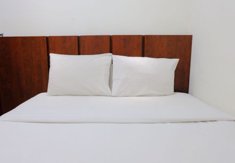 卧室 Modern and Homey Designed 2BR Apartment Parahyangan Residence By Travelio