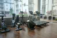 Fitness Center Simple and Modern Studio (No Kitchen) Apartment at Suncity Residence By Travelio