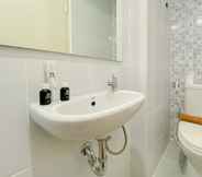 In-room Bathroom 3 Homey and Simply Studio Tokyo Riverside PIK 2 Apartment By Travelio