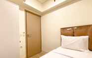 Bedroom 2 Modern and Homey 2BR at 6th Floor Meikarta Apartment By Travelio