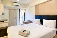 Bedroom Modern Look Studio Apartment at Meikarta By Travelio