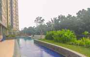 Swimming Pool 7 Comfy and Modern Studio at Transpark Cibubur Apartment By Travelio