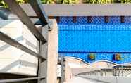 Swimming Pool 5 Modern Look Studio Apartment at 17th Floor Azalea Suites By Travelio