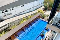 Swimming Pool Nice and Minimalist Studio at Azalea Suites Apartment By Travelio
