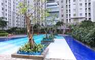 Swimming Pool 6 Fully Furnished and Homey Studio at Green Bay Pluit Apartment By Travelio