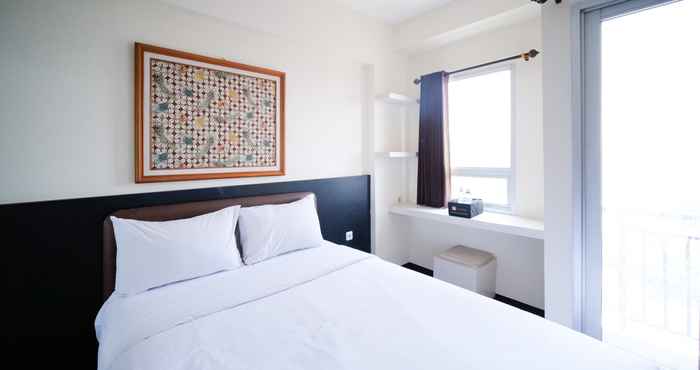 Kamar Tidur Homey and Nice Studio at Puri Mas Apartment By Travelio