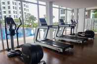 Fitness Center Homey and Minimalist 1BR M-Town Signature Apartment By Travelio