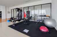 Fitness Center Homey Living Studio Apartment at Tamansari Bintaro Mansion By Travelio