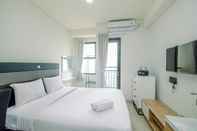 Bedroom Modern and Comfy Studio Transpark Cibubur Apartment By Travelio