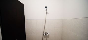 In-room Bathroom 4 Cozy Stay and Tidy Studio Apartment at Suncity Residence By Travelio