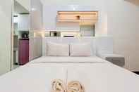 Bedroom Homey and Cozy Living Studio Vida View Makassar Apartment By Travelio