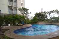 Swimming Pool Modern Look Studio at Apartment Bogor Valley By Travelio