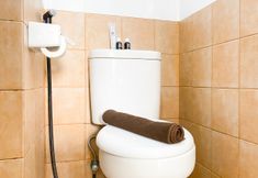 In-room Bathroom 7 Classic and Modern 2BR at Green Pramuka City Apartment By Travelio