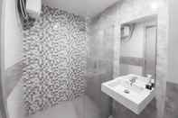 In-room Bathroom Cozy and Comfort Living Studio Mataram City Apartment By Travelio