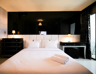 Bedroom 2 Comfy and Spacious 2BR Apartment at Aryaduta Residence Surabaya By Travelio