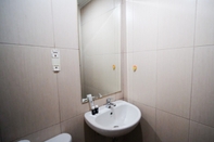 In-room Bathroom Clean and Nice Studio No Kitchen at Tamansari Papilio Apartment By Travelio