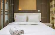 Bedroom 2 Spacious Combined 2BR Dago Suites Apartment By Travelio