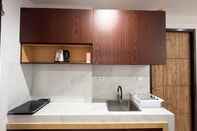 Common Space Spacious 2BR at Apartment Delft Ciputra Makassar By Travelio