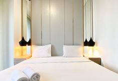 Bedroom 5 Comfort and Elegant 1BR Sudirman Suites Apartment By Travelio