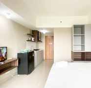 Bedroom 2 Homey and Comfy Studio at Gateway Park LRT City Bekasi Apartment By Travelio