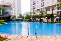 Swimming Pool Modern Look 1BR at Scientia Residence Apartment By Travelio