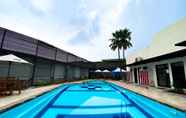 Swimming Pool 7 Warm and Homey Studio at Metropark Condominium Jababeka Apartment By Travelio