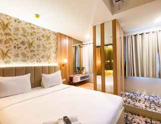 Bedroom 2 Modern Look and Comfy 1BR Gateway Park LRT City Bekasi Apartment By Travelio