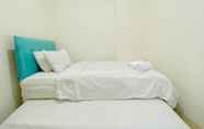 Bedroom 2 Homey and Good Choice 2BR at Green Pramuka City Apartment By Travelio