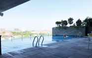 Swimming Pool 7 Comfy and Best Location 2BR at Tamansari Papilio Apartment By Travelio