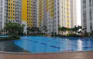 Swimming Pool 7 Great Deal and Cool Studio at Springlake Summarecon Bekasi Apartment By Travelio