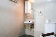 In-room Bathroom Spacious and Cozy Studio The Edge Bandung Apartment By Travelio