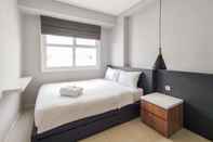 ห้องนอน Stylish and Convenient 1BR Apartment Parahyangan Residence By Travelio