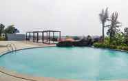 Kolam Renang 7 Cozy and Good Choice 2BR Grand Kamala Lagoon Apartment By Travelio