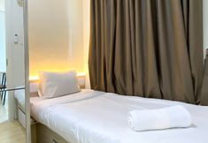 Bedroom 2 Modern and Good 2BR Daan Mogot City Apartment By Travelio