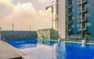 Swimming Pool 7 Comfy and Good Look Studio Apartment at Evenciio Margonda By Travelio