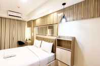 Kamar Tidur Homey and Good Deal 1BR Tamansari Skylounge Makassar Apartment By Travelio