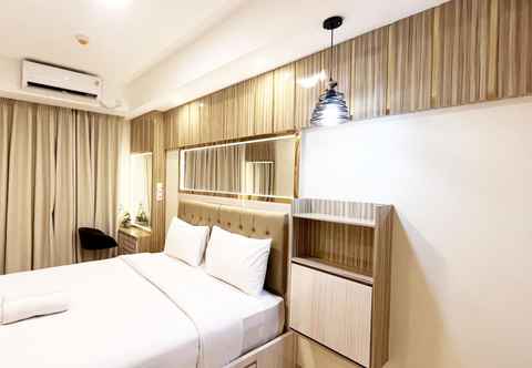 Bedroom Homey and Good Deal 1BR Tamansari Skylounge Makassar Apartment By Travelio