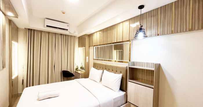 Bedroom Homey and Good Deal 1BR Tamansari Skylounge Makassar Apartment By Travelio