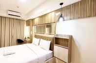 Bedroom Homey and Good Deal 1BR Tamansari Skylounge Makassar Apartment By Travelio