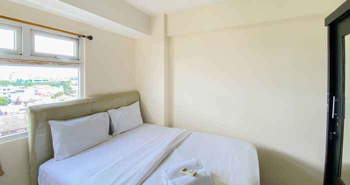 Bedroom Comfort and Homey 2BR Green Pramuka City Apartment By Travelio