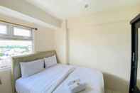 Bedroom Comfort and Homey 2BR Green Pramuka City Apartment By Travelio